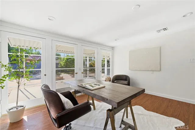a view of a workspace with a table and chair