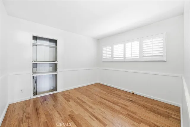 a room with a bed and a cabinet