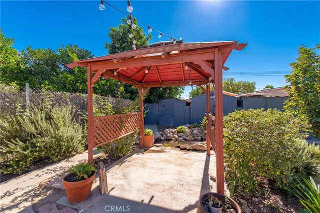a view of a backyard with sitting area