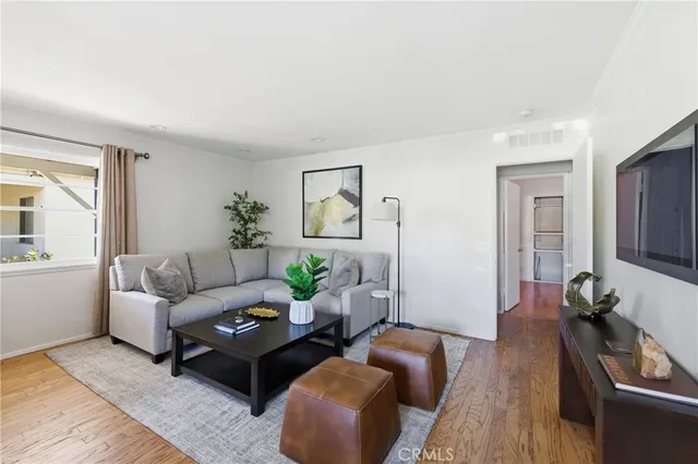 a living room with furniture rug and window