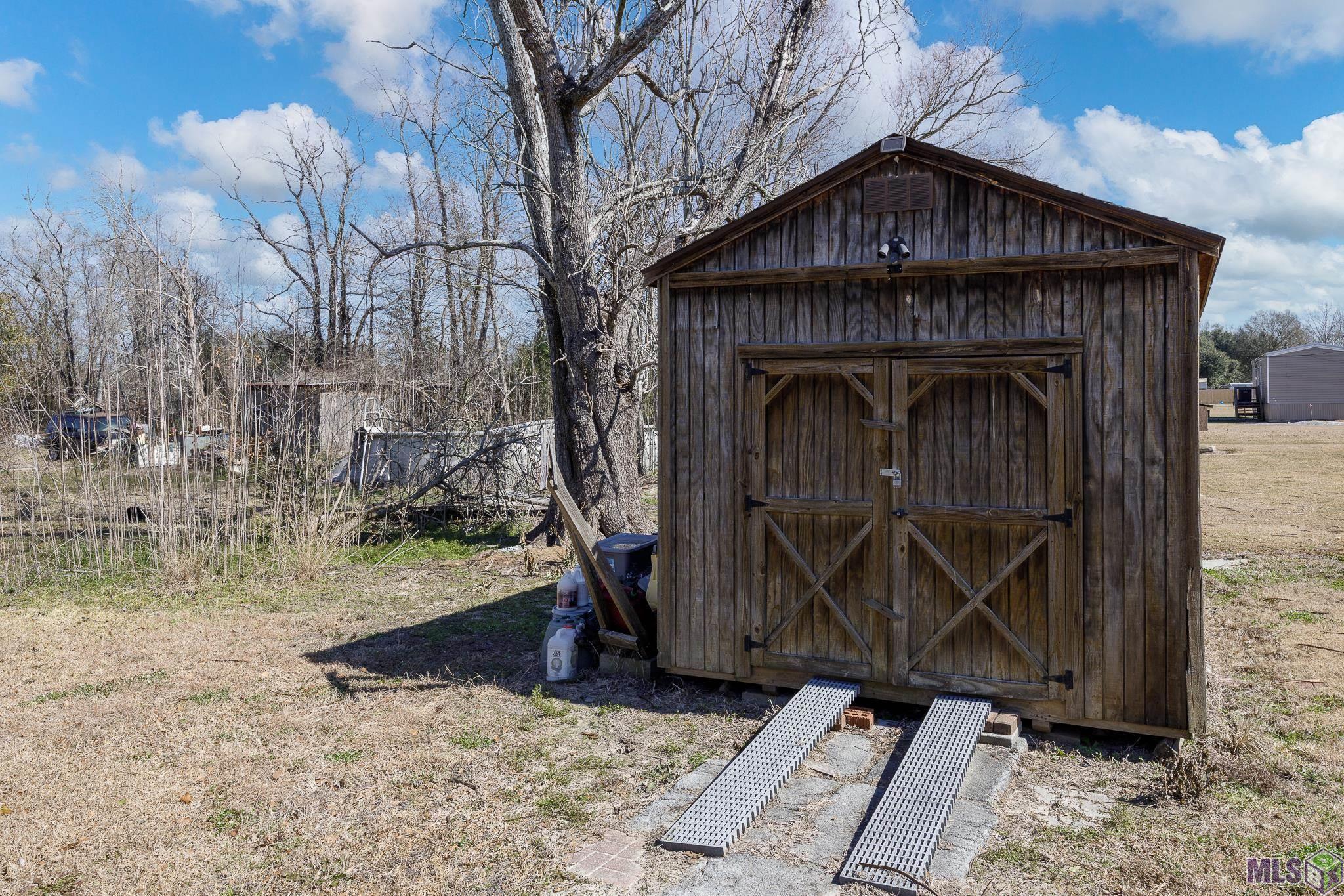 11486 Tannis Rd. St. Amant, LA 70774 - Photo 22 of 27 Storage Shed
