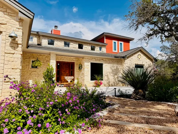 a front view of a house with yard