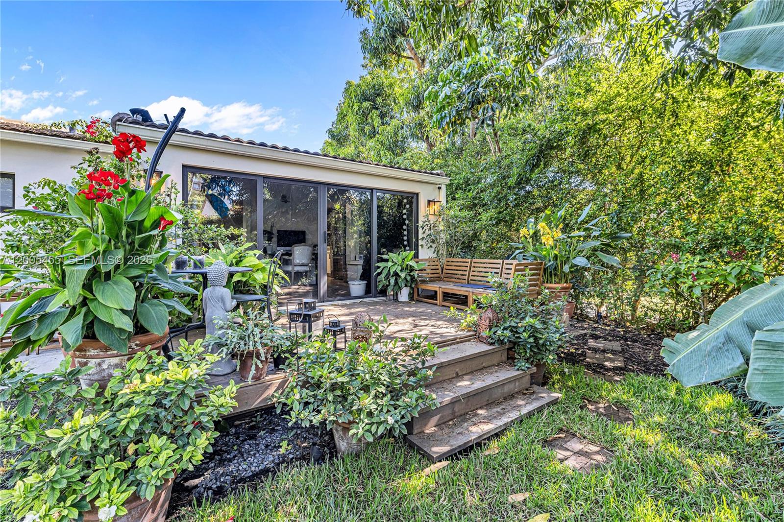3030 Southwest 2nd Avenue Miami, FL 33129 - Photo 13 of 15 a view of a patio with table and chairs and potted plants