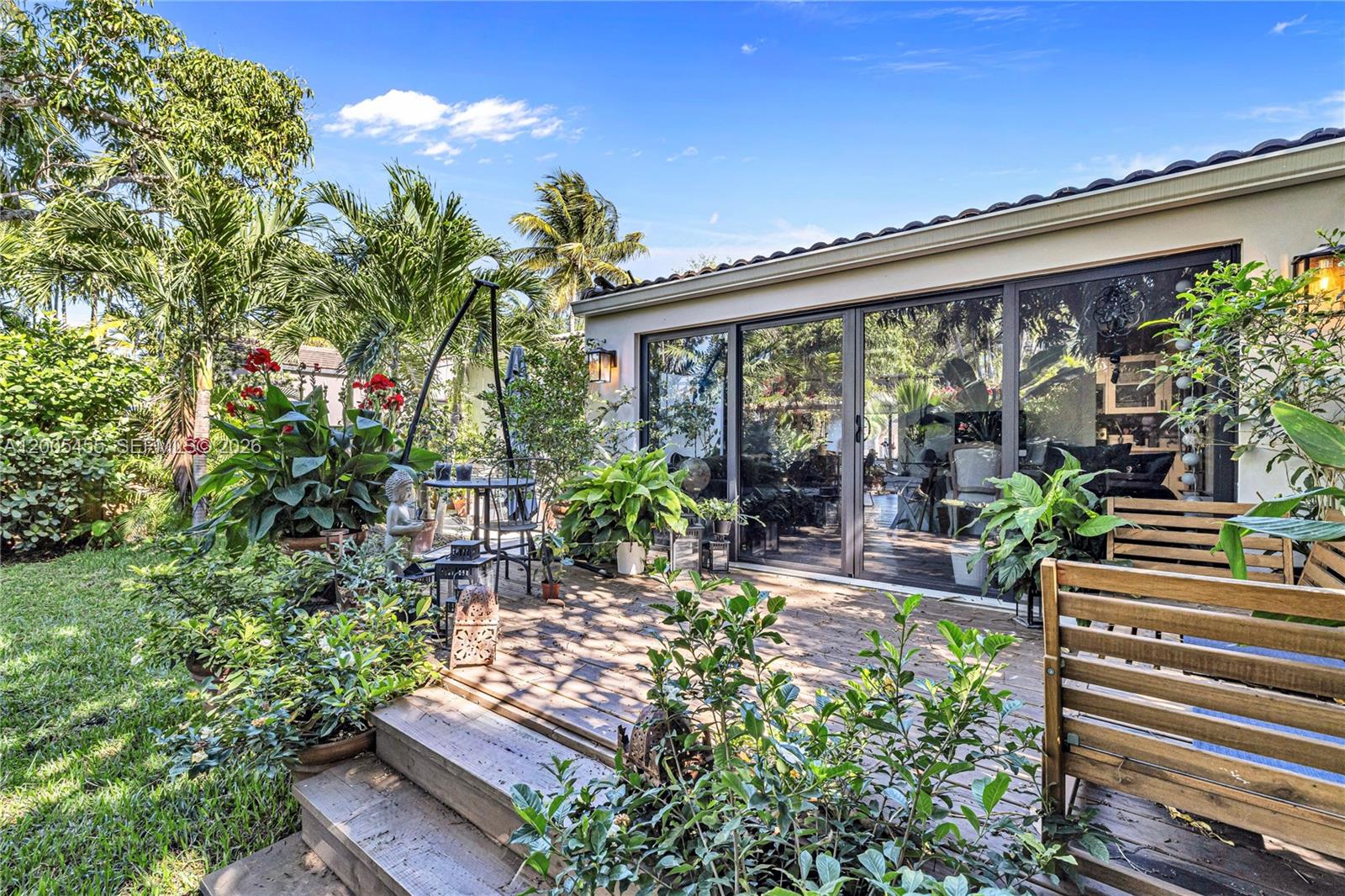3030 Southwest 2nd Avenue Miami, FL 33129 - Photo 14 of 15 a view of a chairs and table in a backyard