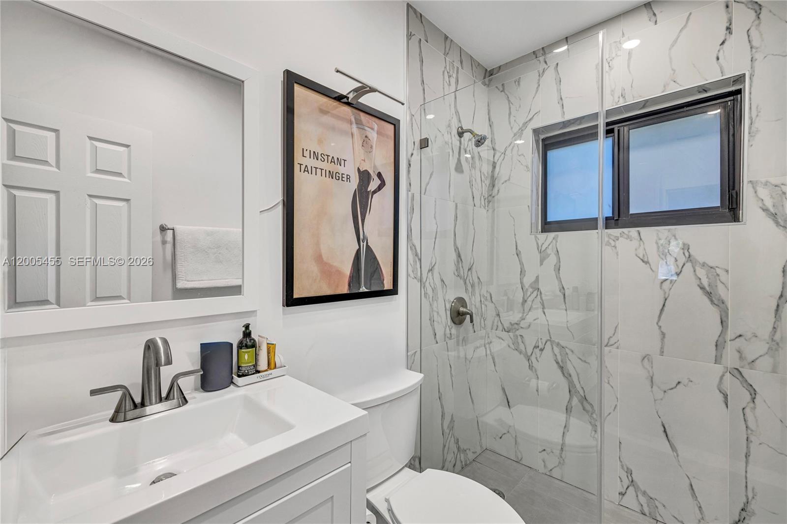 3030 Southwest 2nd Avenue Miami, FL 33129 - Photo 8 of 15 a bathroom with a toilet sink and shower