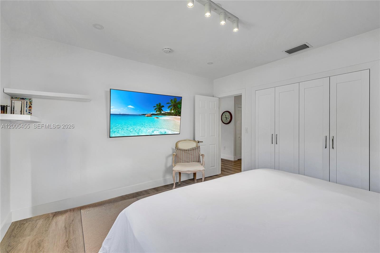 3030 Southwest 2nd Avenue Miami, FL 33129 - Photo 9 of 15 a bedroom with a bed and glass wall