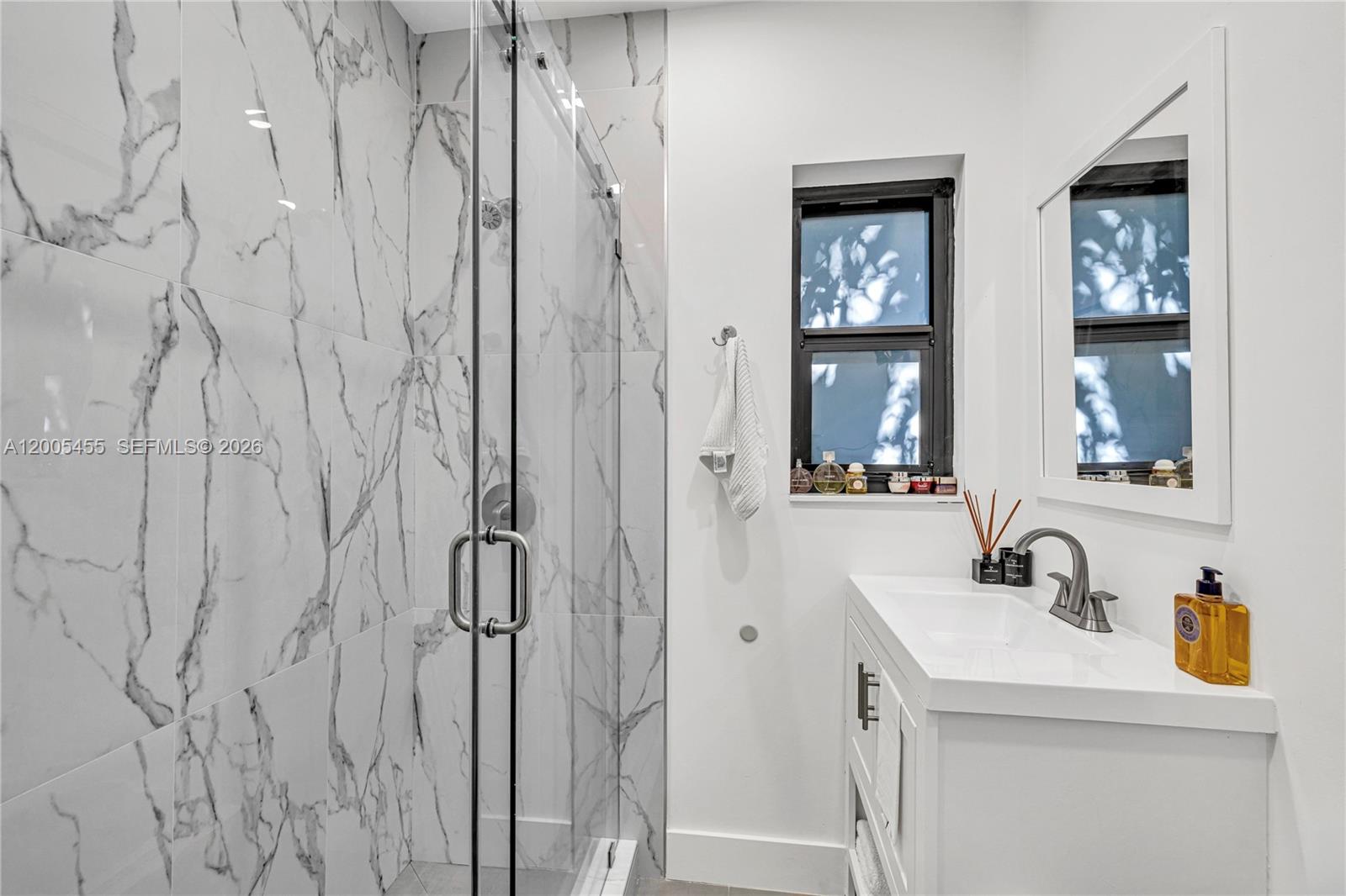 3030 Southwest 2nd Avenue Miami, FL 33129 - Photo 10 of 15 a bathroom with double vanity sink and a mirror