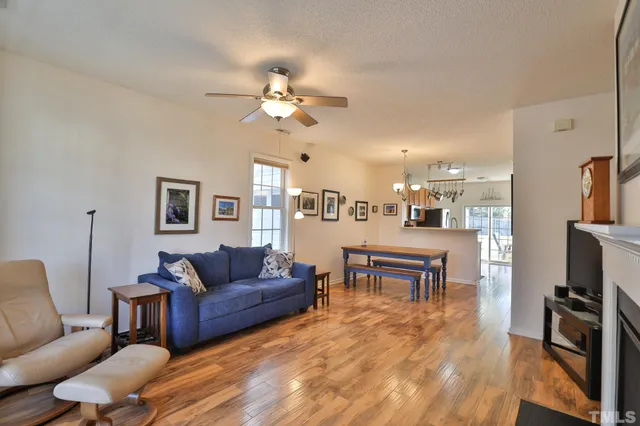 a living room with furniture fireplace and flat screen tv