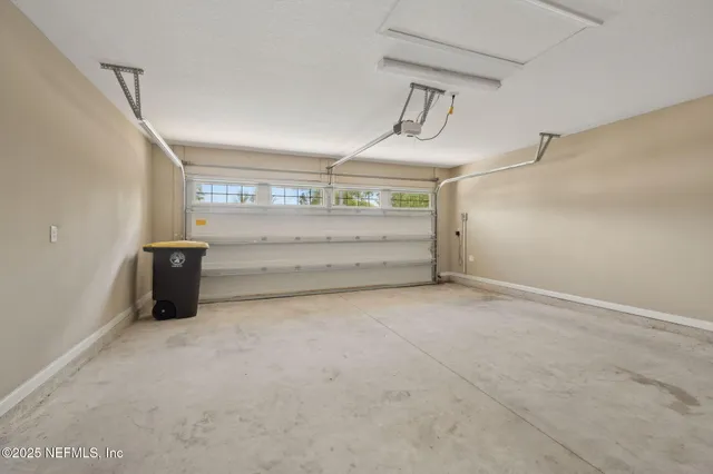 a view of a house with yard and a garden