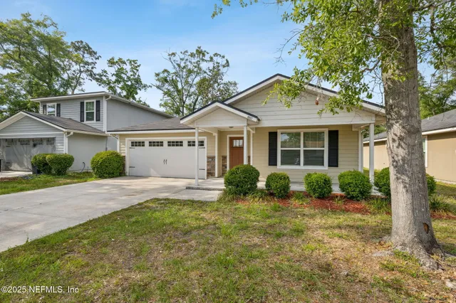 front view of a house with a yard