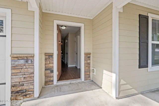 a view of a wooden door of the house