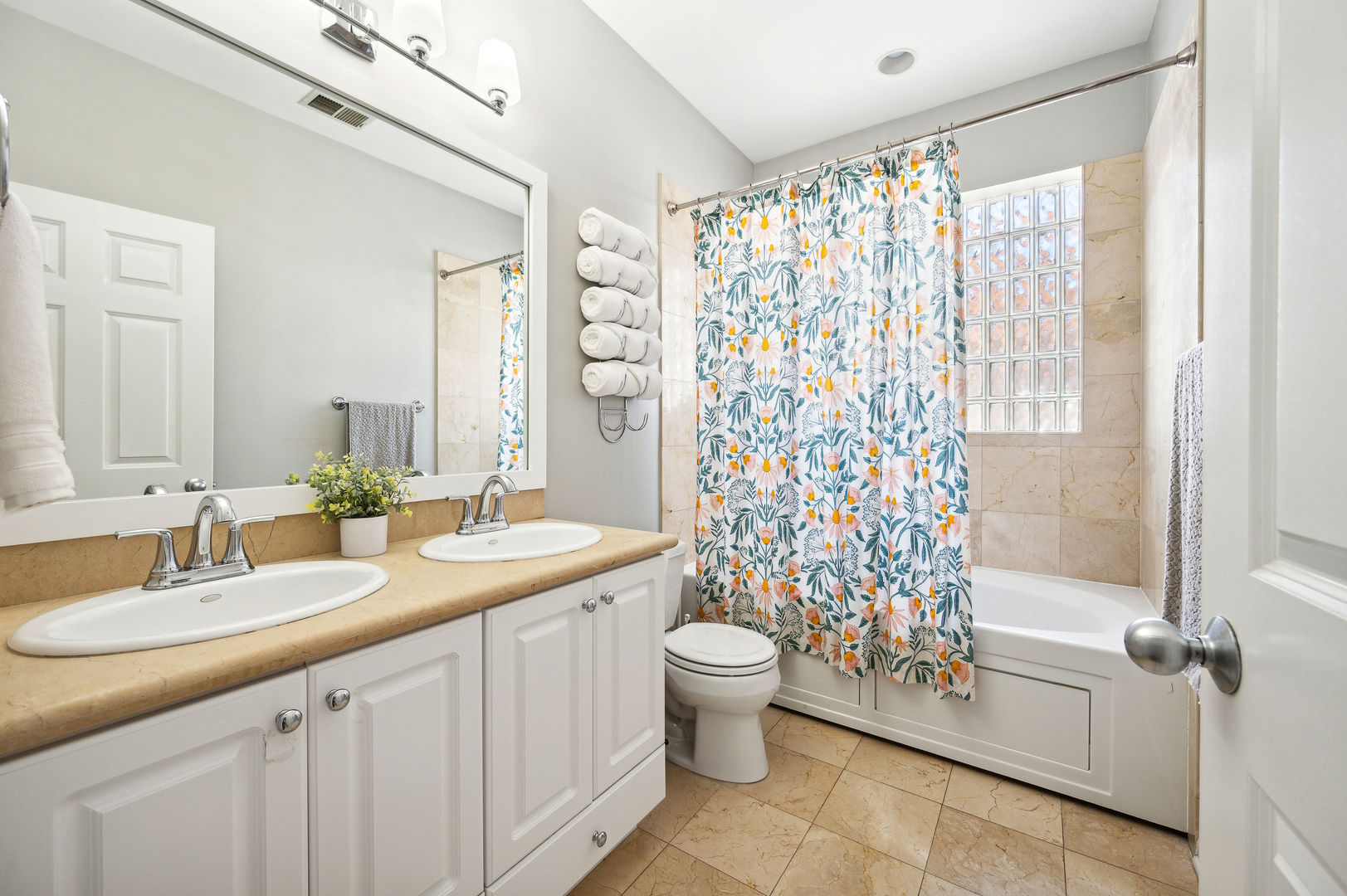 3223 North Seminary Avenue, Unit 3 Chicago, IL 60657 - Photo 12 of 17 a bathroom with a granite countertop sink a toilet a mirror a vanity and shower