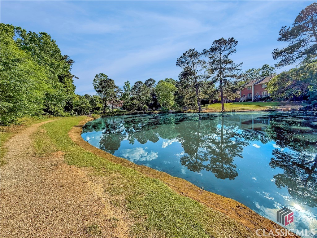 445 Logmont Trace, Unit 17 Athens, GA 30606 - Photo 26 of 28 View at the Back of the Townhome of a pond at an adjacent community
