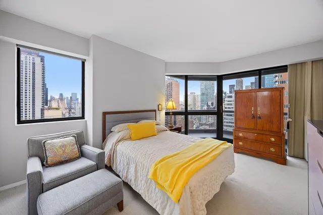 a bathroom with a sink mirror and toilet
