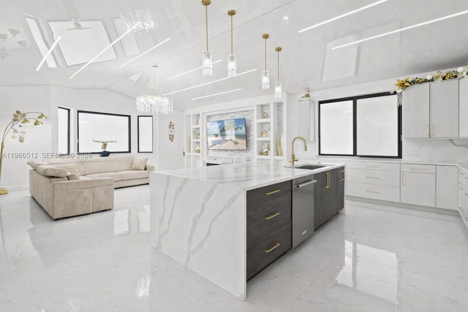 17795 Southwest 158th Street Miami, FL 33187 - Photo 11 of 31 a large white kitchen with a large window