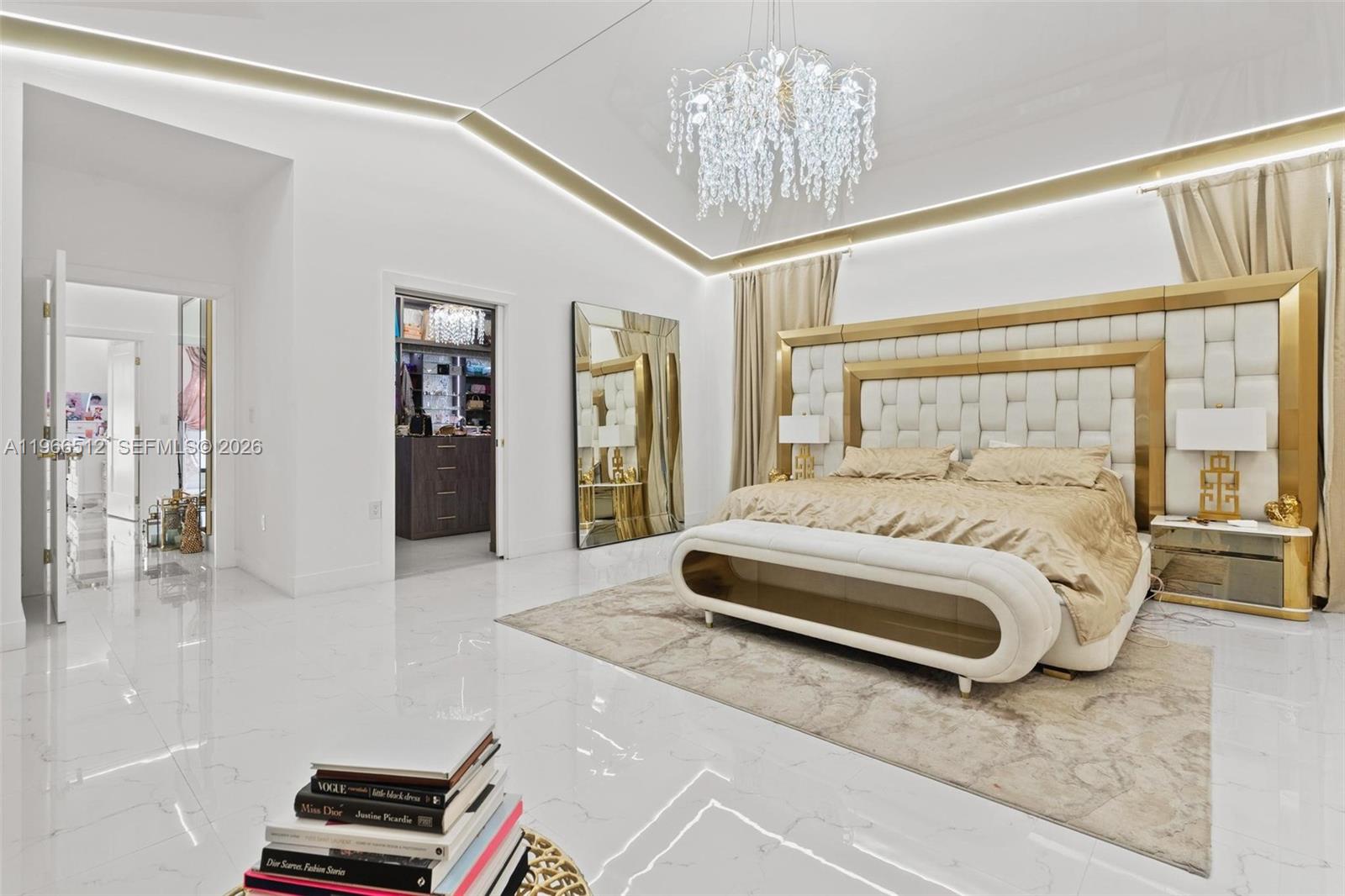 17795 Southwest 158th Street Miami, FL 33187 - Photo 18 of 31 a spacious bedroom with a bed and a chandelier