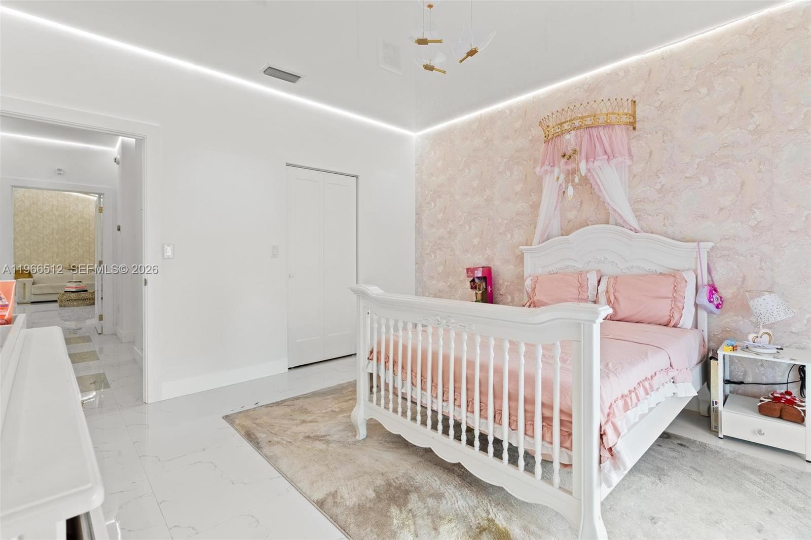 17795 Southwest 158th Street Miami, FL 33187 - Photo 19 of 31 a bedroom with a bed and a window