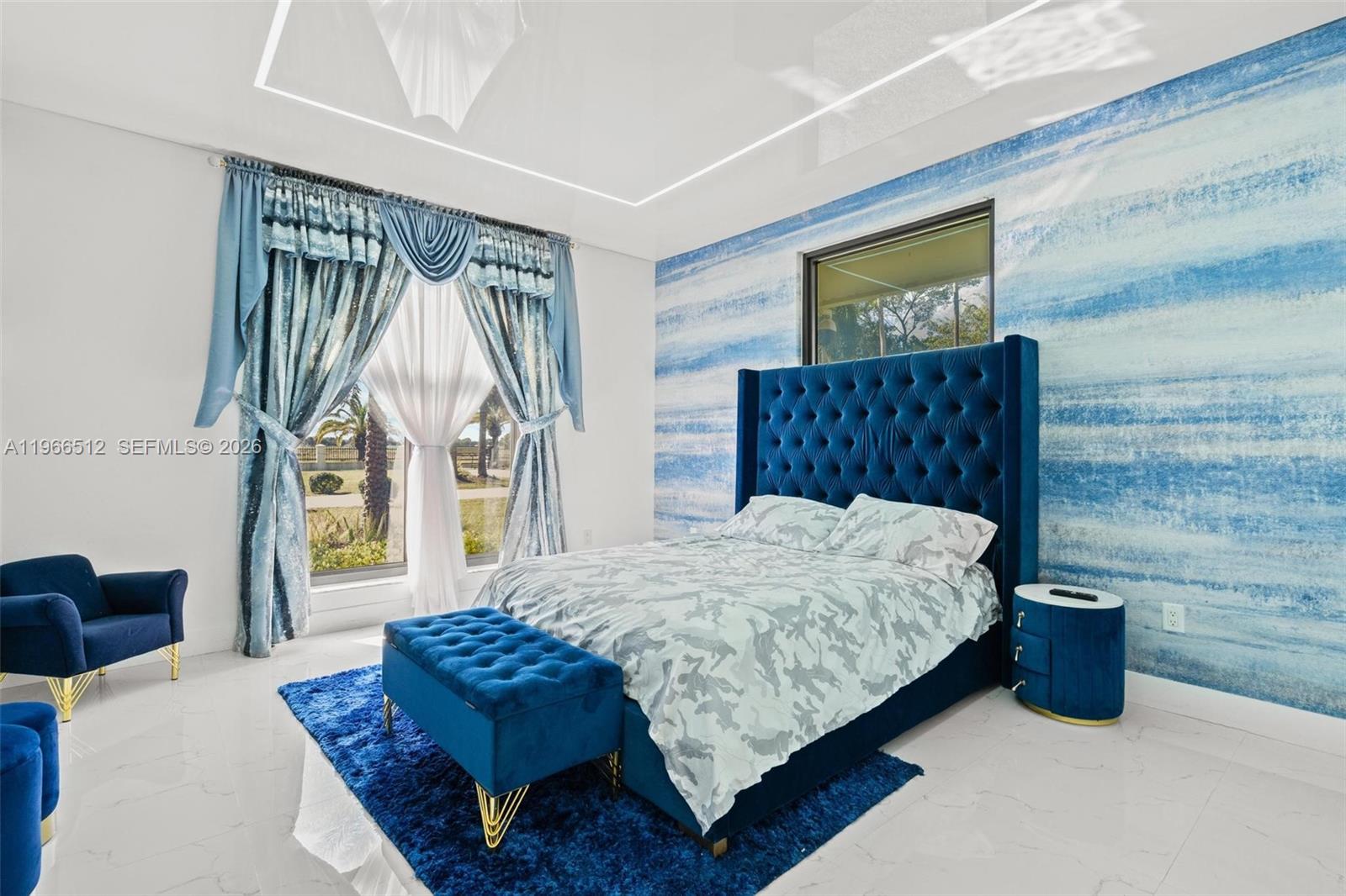 17795 Southwest 158th Street Miami, FL 33187 - Photo 21 of 31 a bedroom with a bed window and a flat screen tv