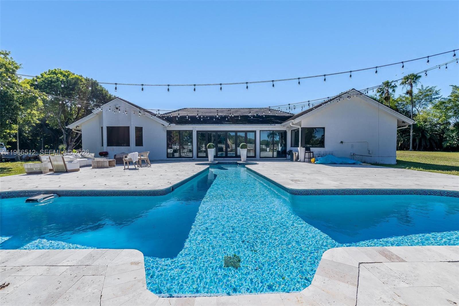 17795 Southwest 158th Street Miami, FL 33187 - Photo 24 of 31 a swimming pool view with a outdoor seating