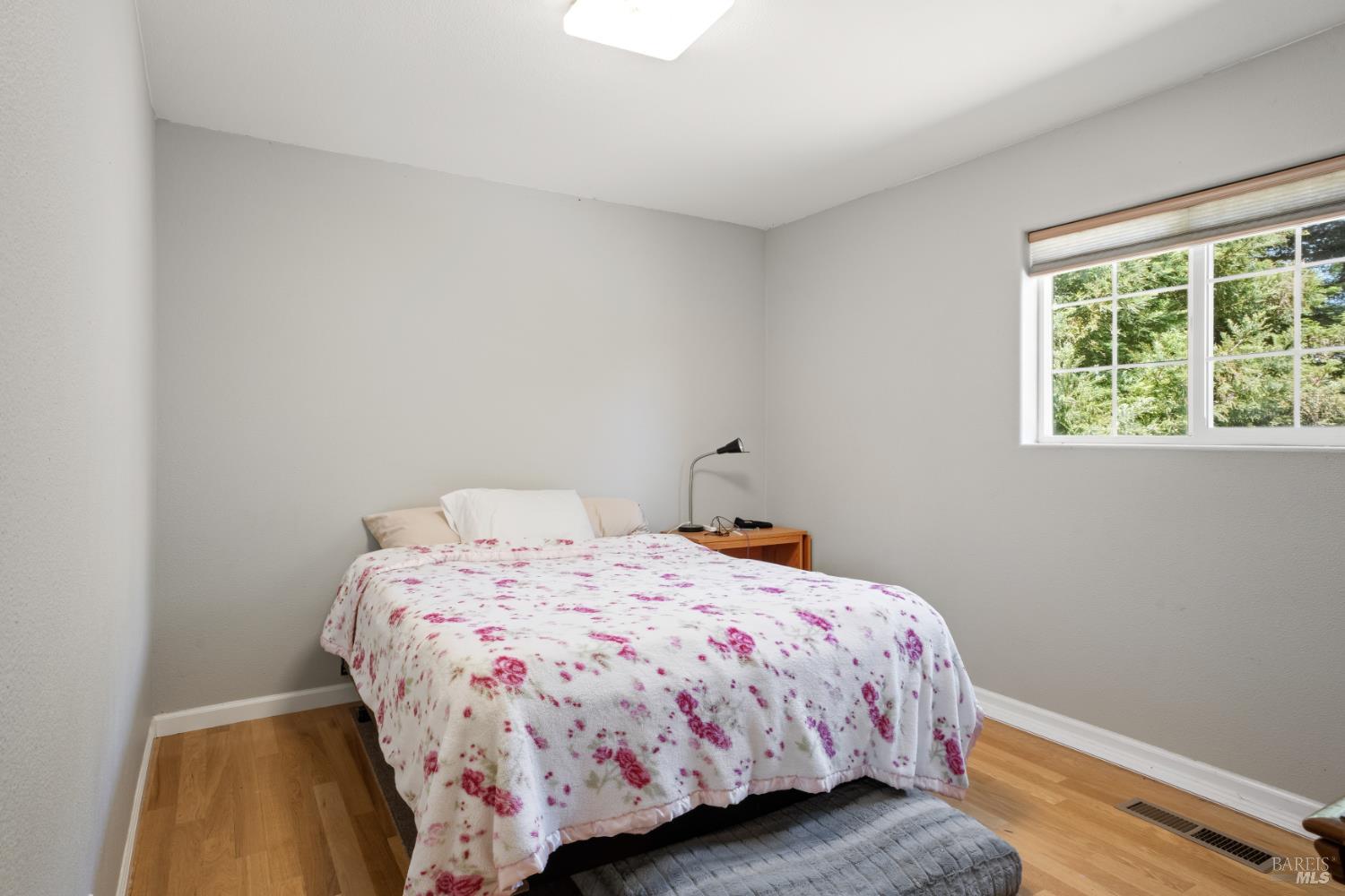 1435 Big Valley Road Lakeport, CA 95453 - Photo 11 of 21 a bedroom with a bed and a window