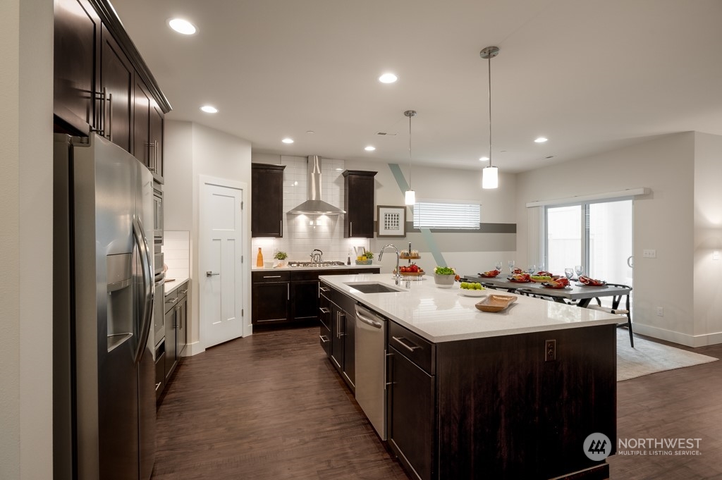 29 178th Place Southwest, Unit IW 78 Bothell, WA 98012 - Photo 6 of 32 a kitchen with a sink stove and refrigerator