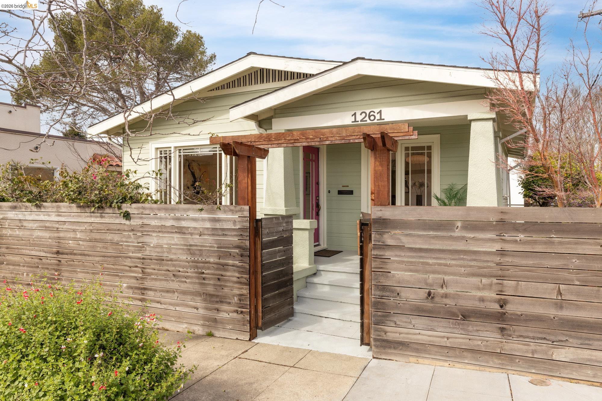 1261 Hearst Avenue Berkeley, CA 94702 - Photo 1 of 1 a front view of a house with a glass door