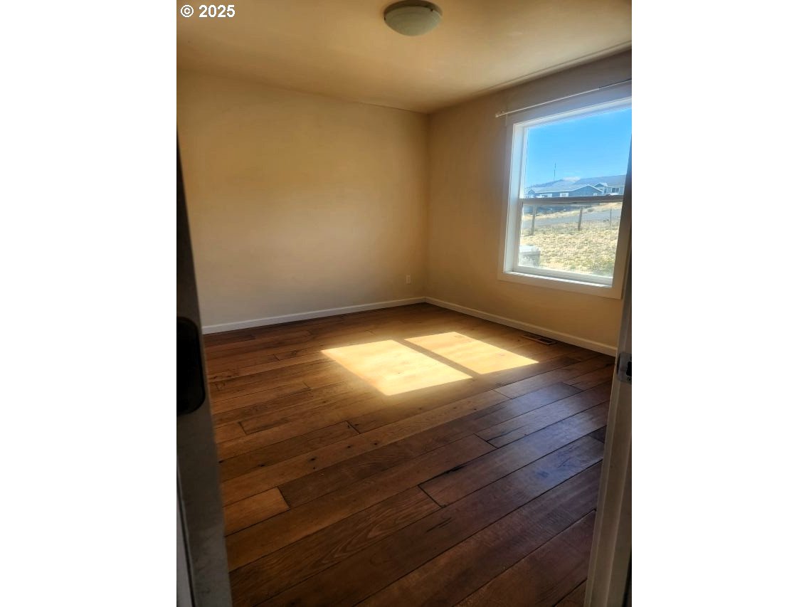 1335 Childers Road Arlington, OR 97812 - Photo 12 of 25 a view of an empty room and window