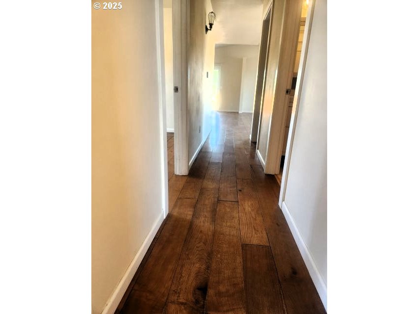 1335 Childers Road Arlington, OR 97812 - Photo 17 of 25 a view of a hallway with wooden floor