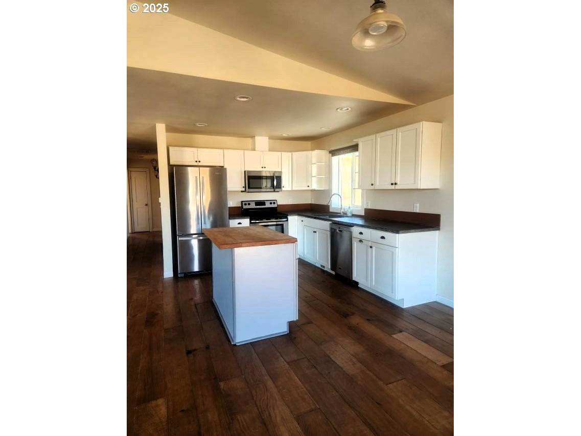 1335 Childers Road Arlington, OR 97812 - Photo 5 of 25 a kitchen with a sink cabinets and stainless steel appliances