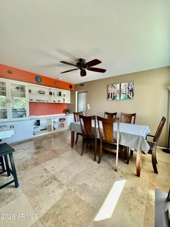 a bedroom with a bed and ceiling fan