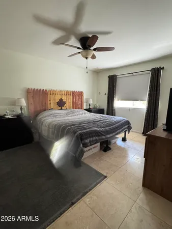 a bathroom with a sink mirror and a shower