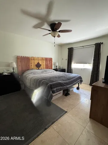a bathroom with a sink mirror and a shower