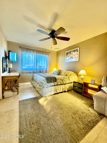 a bedroom with a bed and window