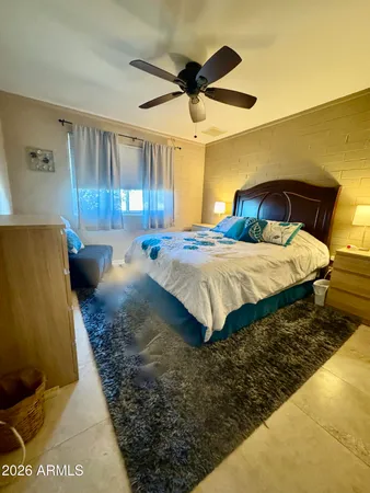 a white toilet sitting next to a shower curtain