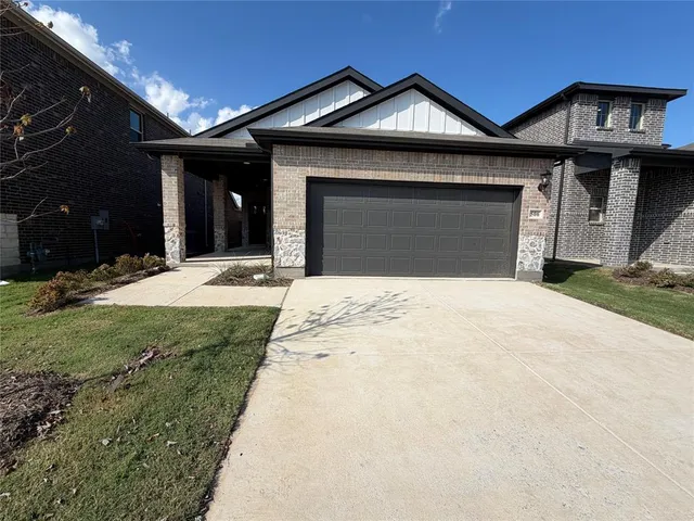 a front view of a house with yard