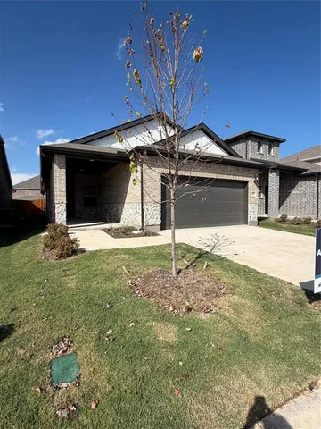 a view of a backyard of the house