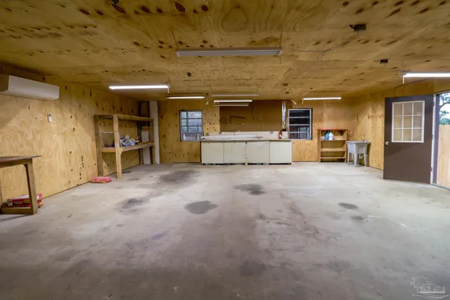 a view of a livingroom with furniture and a flat screen tv