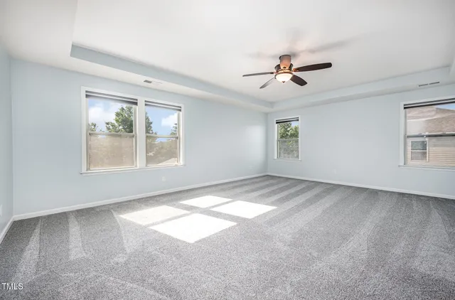 a view of a big room with windows and closet