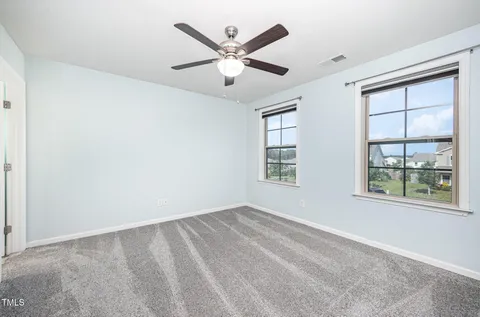 a spacious bathroom with a tub sink shower and mirror
