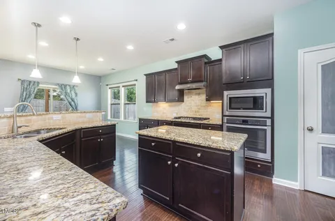 an aerial view of a house with swimming pool