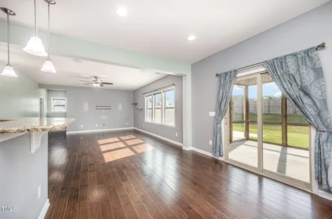 a kitchen with a stove a sink and a microwave