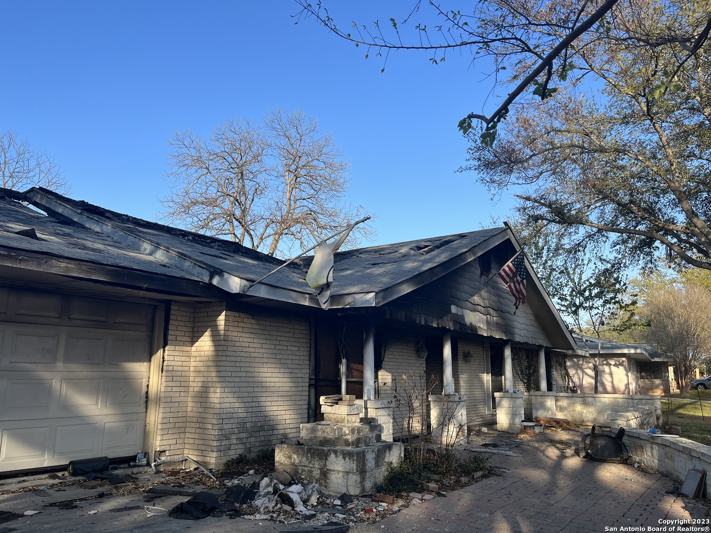 421 Faircrest Drive Windcrest, TX 78239 - Photo 1 of 1 a front view of a house with basket ball court and outdoor seating