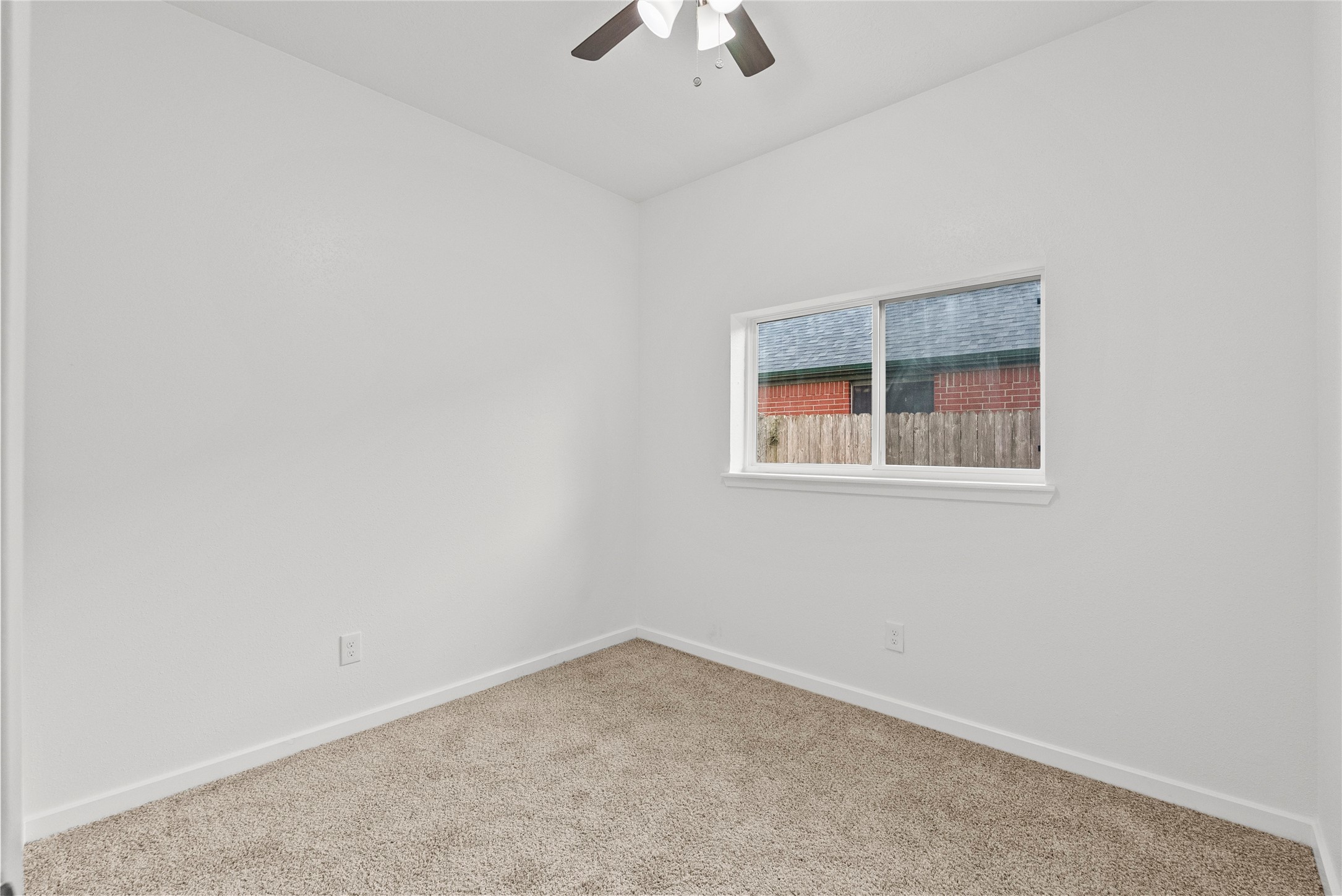 617 Prairie Lane Angleton, TX 77515 - Photo 13 of 29 Bedroom 1 with large window for natural light.