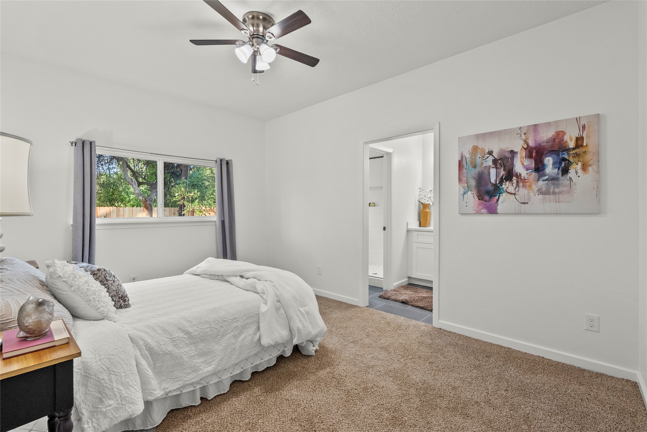617 Prairie Lane Angleton, TX 77515 - Photo 19 of 29 This inviting primary bedroom features natural light, direct access to a new beautiful updated bathroom creating a perfect retreat.