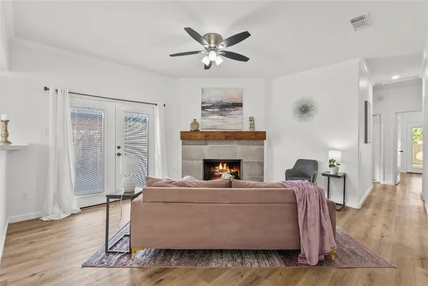 a living room with furniture and a fireplace