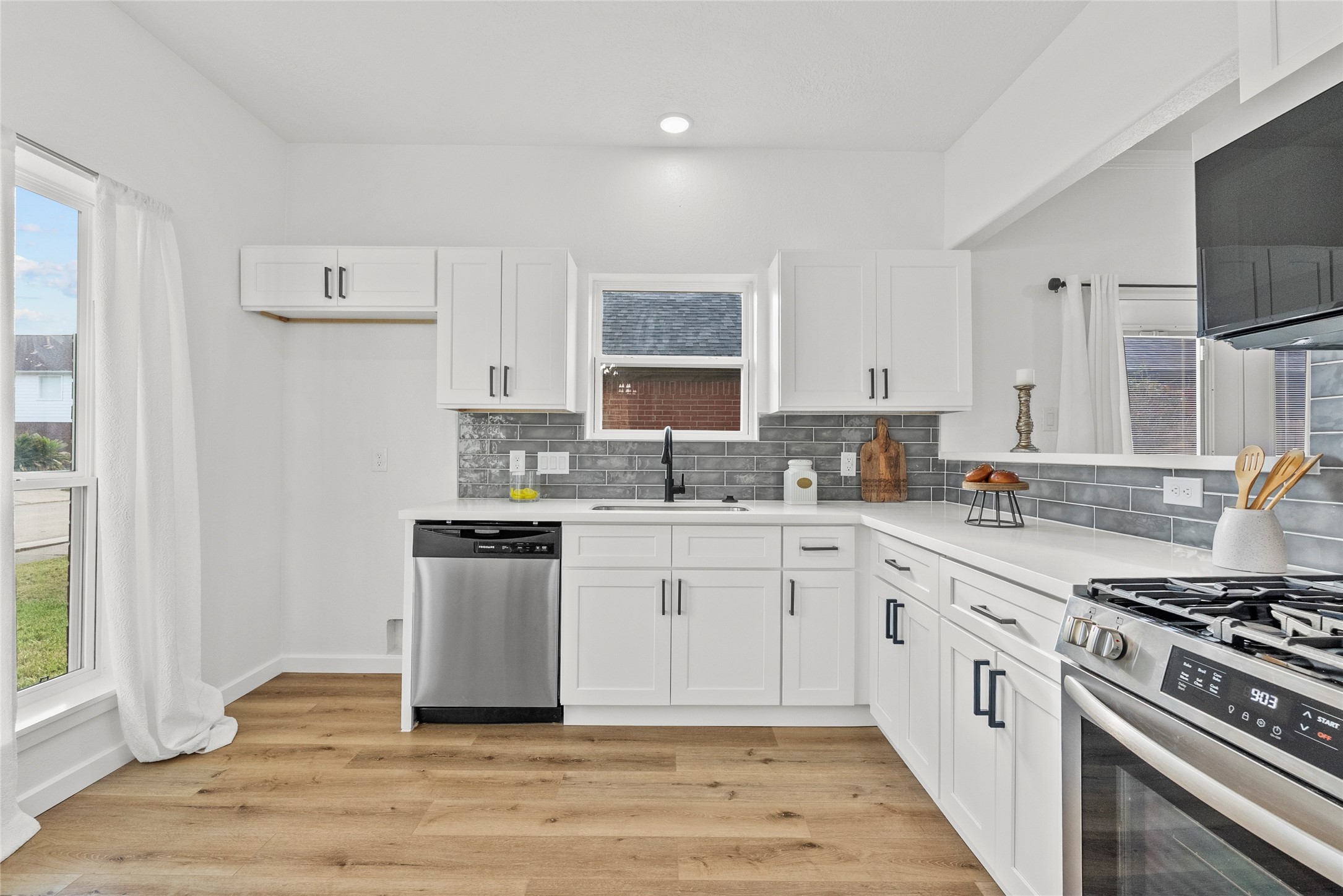 617 Prairie Lane Angleton, TX 77515 - Photo 8 of 29 Modern kitchen featuring brand-new appliances and awesome finishes.