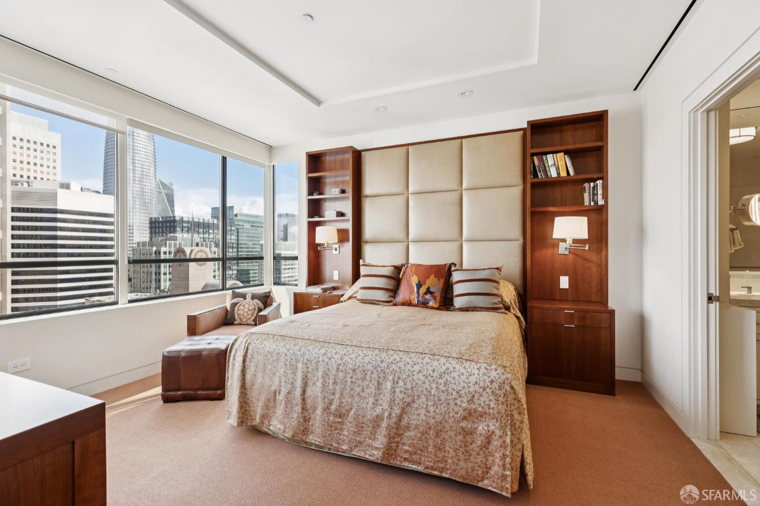 690 Market Street, Unit 2404 San Francisco, CA 94104 - Photo 17 of 36 a bedroom with a large bed and a large window