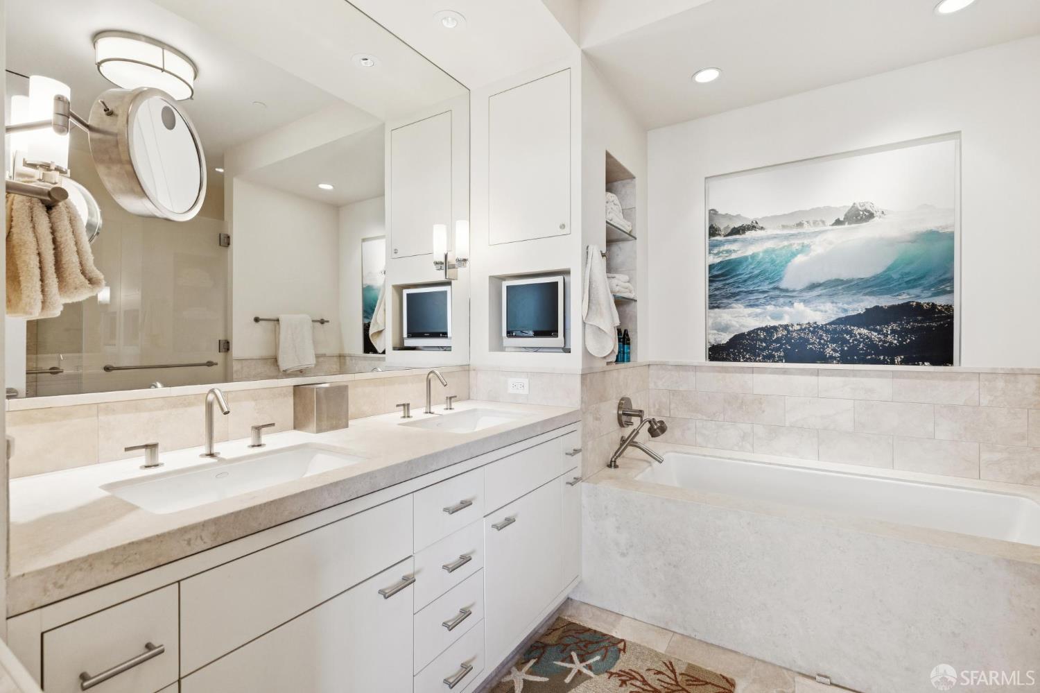 690 Market Street, Unit 2404 San Francisco, CA 94104 - Photo 20 of 36 a bathroom with a double vanity sink mirror and bathtub