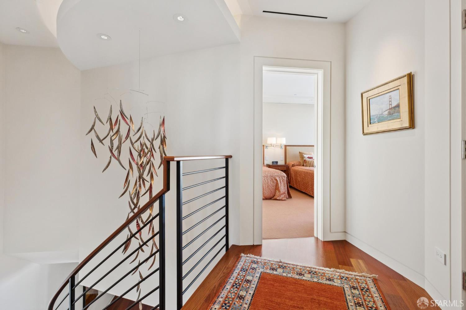 690 Market Street, Unit 2404 San Francisco, CA 94104 - Photo 22 of 36 a view of a hallway and a livingroom with furniture