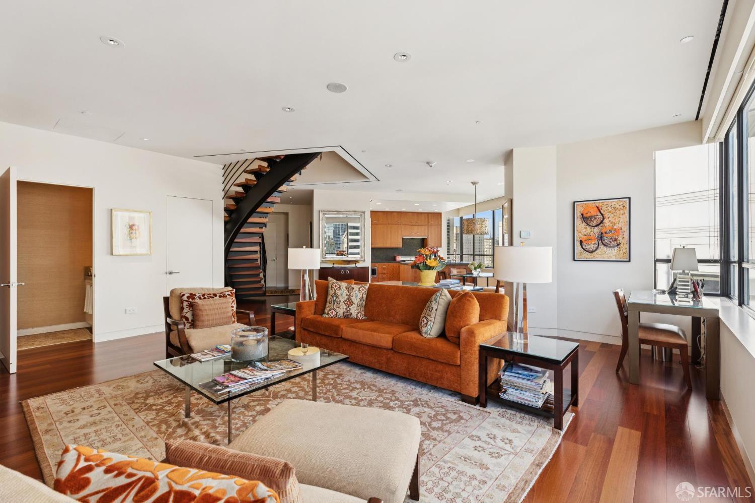 690 Market Street, Unit 2404 San Francisco, CA 94104 - Photo 8 of 36 a living room with furniture wooden floor and a table